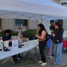 Image of Picnic Day attendees visiting the Fruit and Nut Research and Information Center booth.